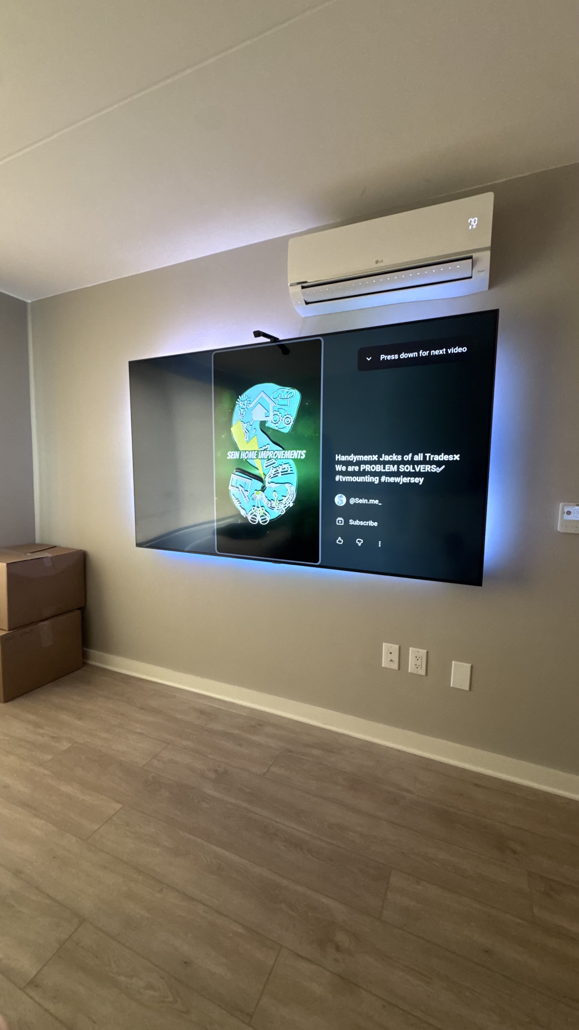 The Halo, a TV wall built by SEIN ME in New Jersey. Clean TV install with LED glow behind the screen and every wire hidden in the wall.