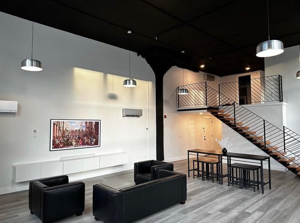 Samsung Frame TV displayed as art in a high-ceiling loft, installed by SEIN ME in Passaic, New Jersey