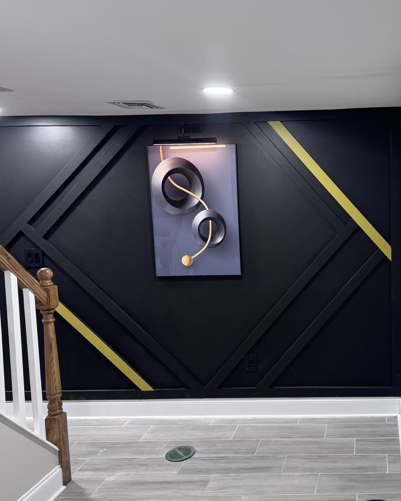 Matte black geometric wall molding with gold diagonal inlays installed by SEIN ME in Union, New Jersey