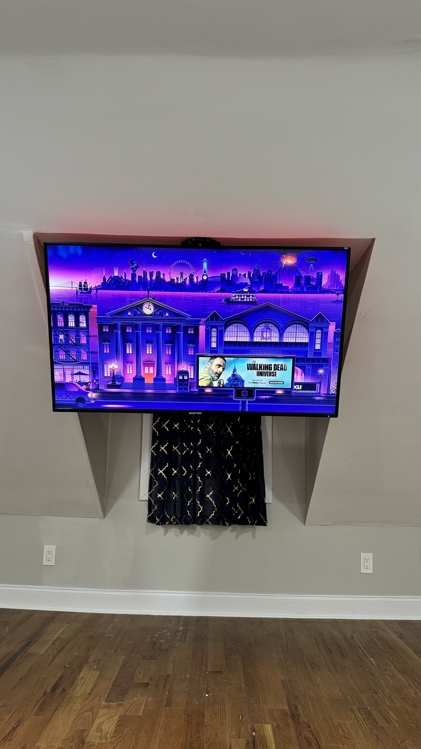 TV mounted on an angled dormer wall above a window in the same Union house, by SEIN ME