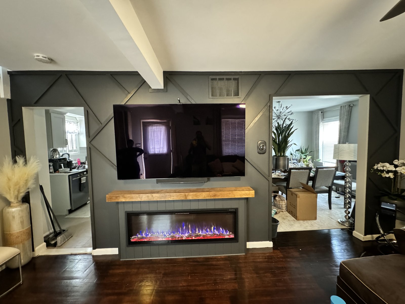 Finished charcoal fireplace media wall in an occupied Plainfield, New Jersey living room by SEIN ME