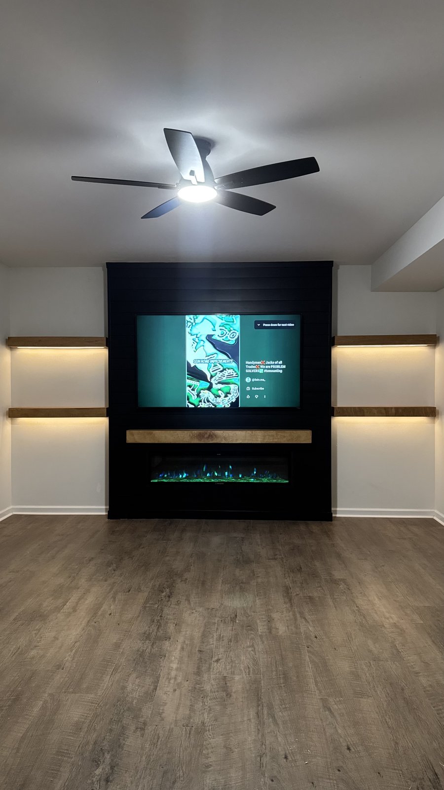 Finished SEIN ME shiplap media wall with floating LED shelves in Pennsylvania