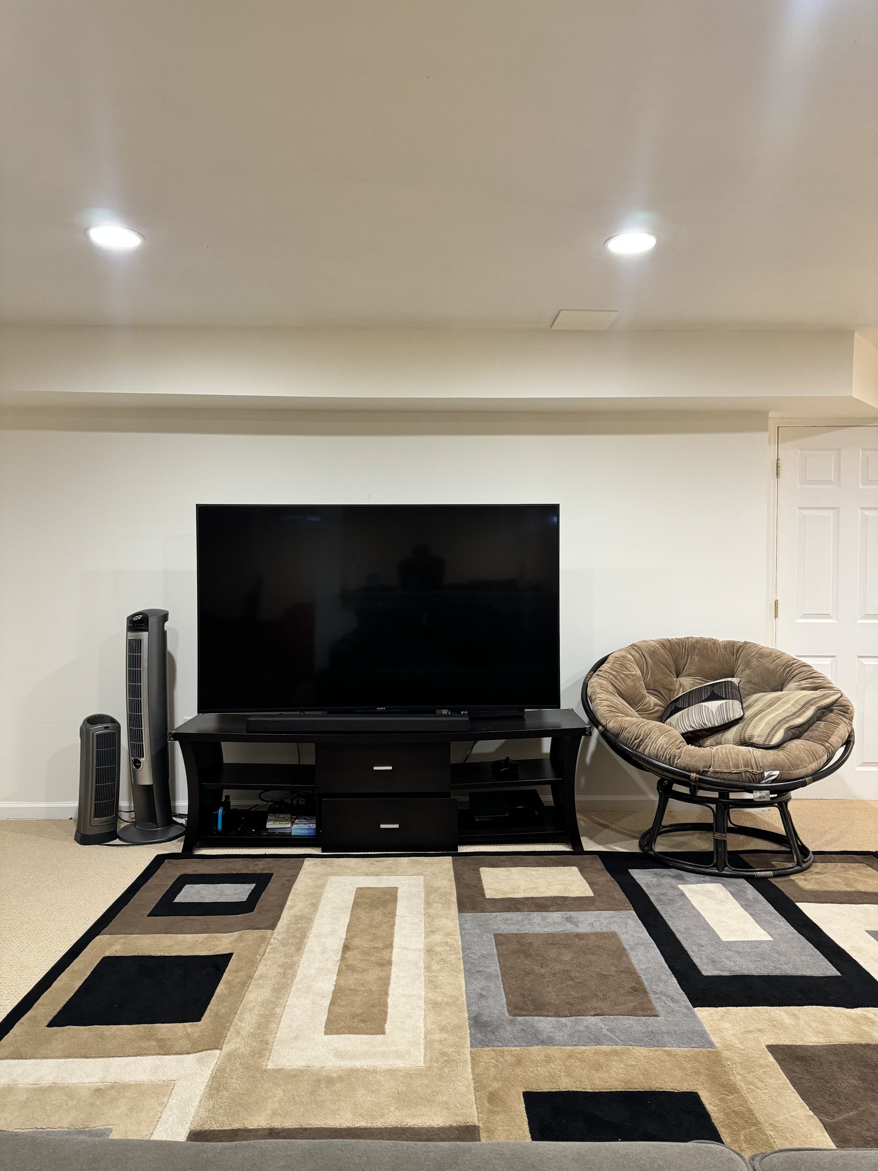 The South River living room before the media wall build, TV on a stand, by SEIN ME