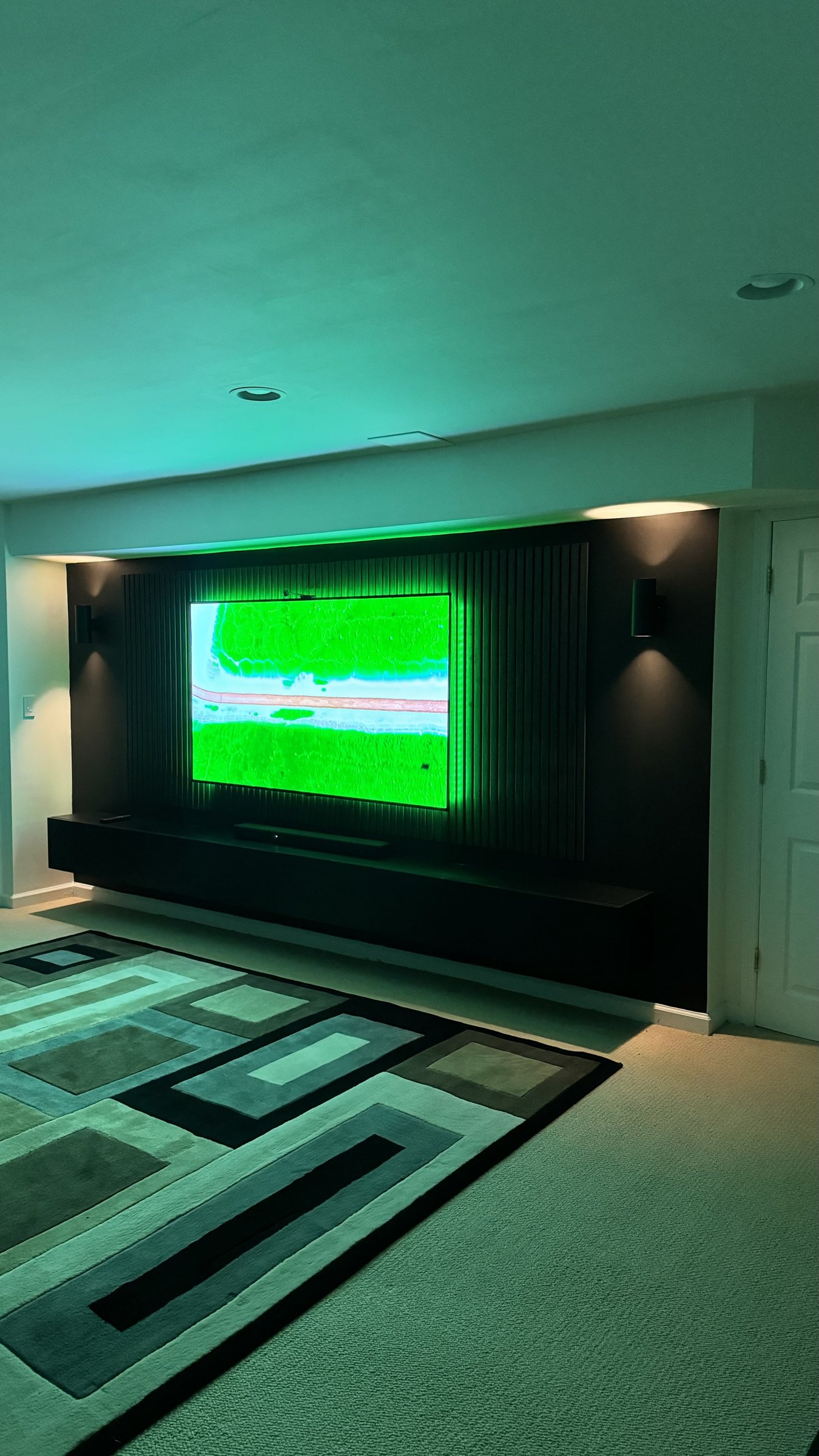 The South River media wall washed in green LED backlight, by SEIN ME