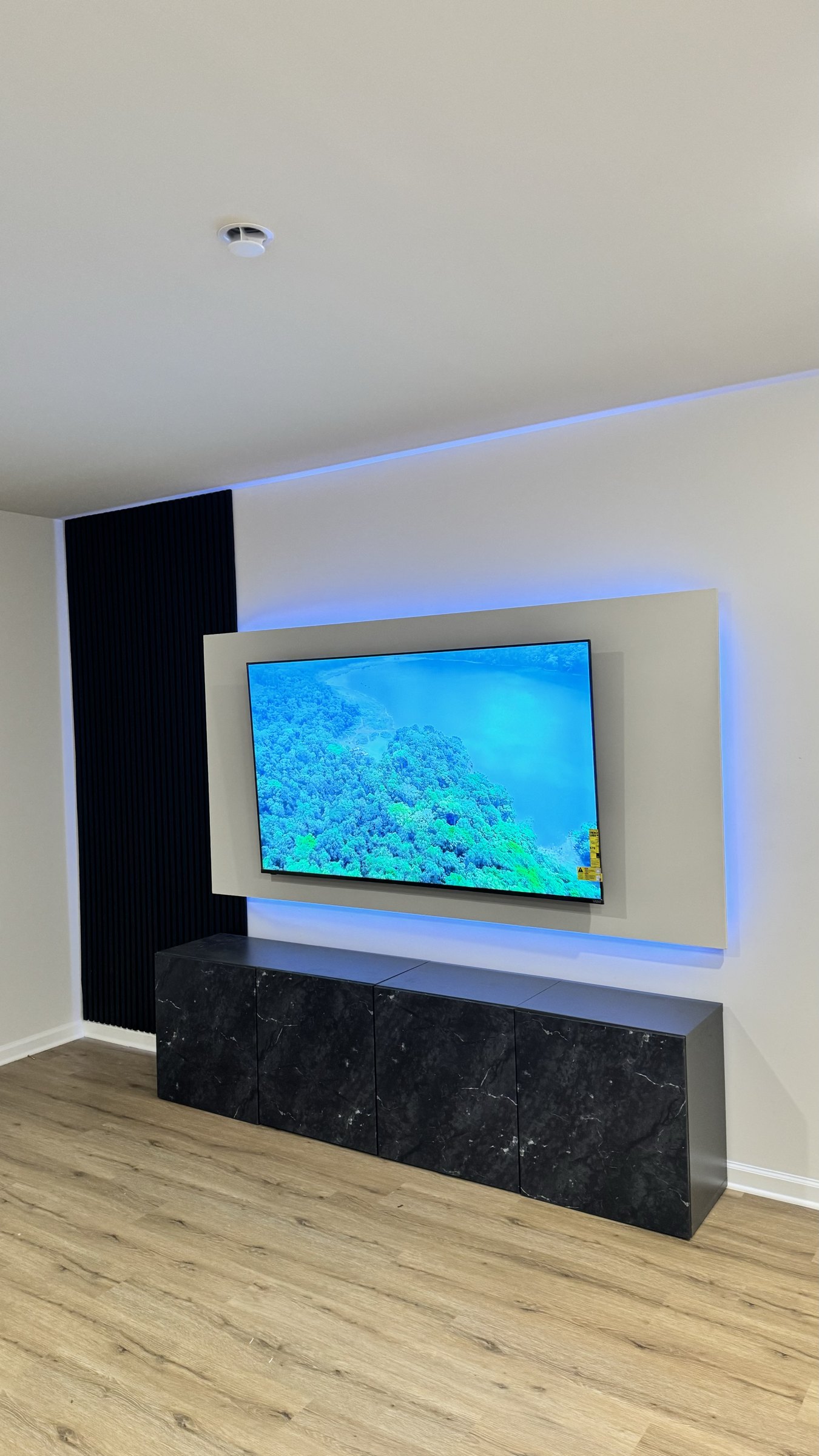 Angled view showing the LED halo wrapping all four edges of the floating panel by SEIN ME in Glendora, New Jersey