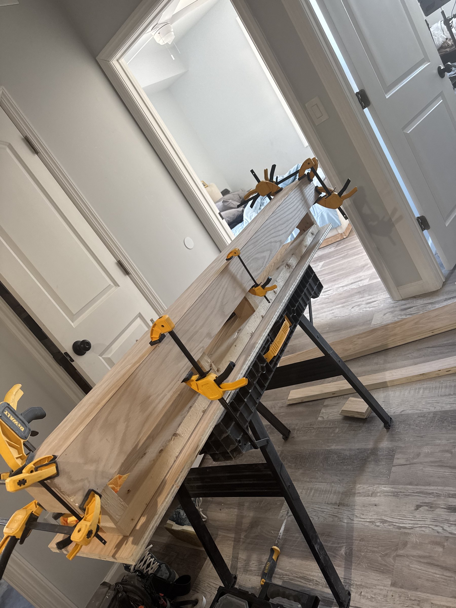 SEIN ME mantel glue-up clamped along its full length while the joints cure