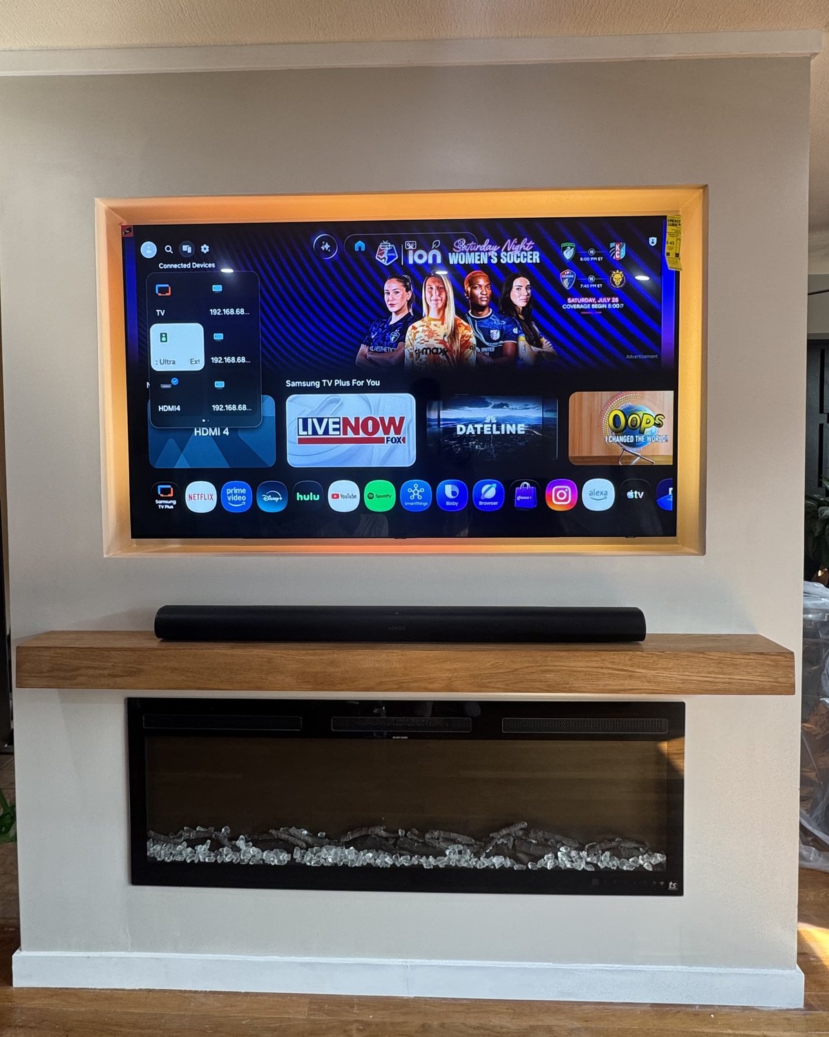 Backlit TV niche with soundbar, oak mantel and fireplace by SEIN ME in Morristown, New Jersey